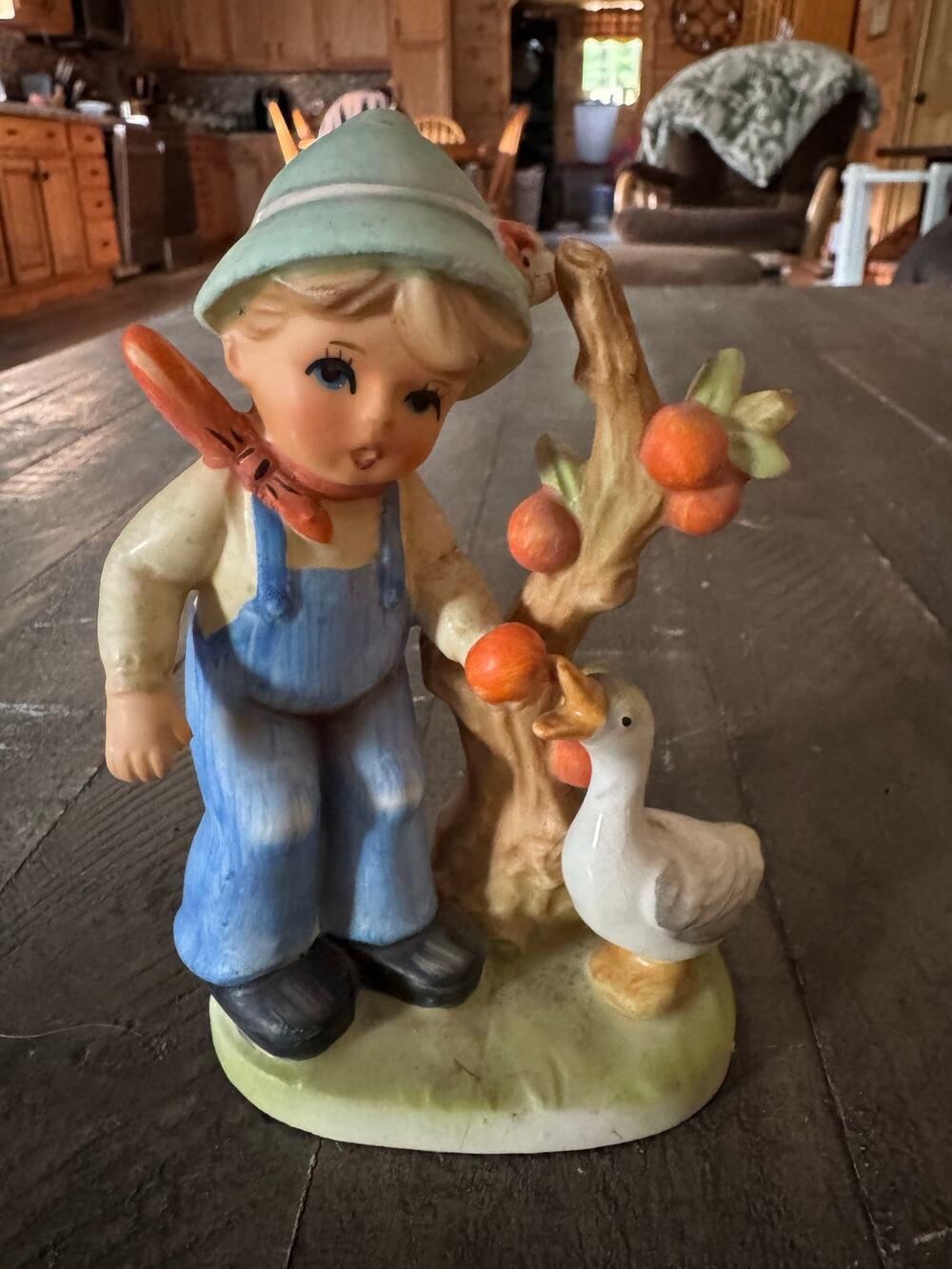Vintage boy feeding a goose figurine